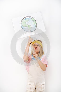 Little girl holding planet earth sign in protest against waste crisis