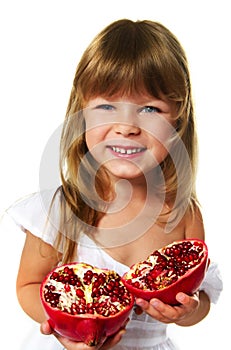 Little girl holding pomegranate