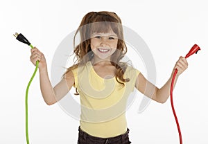 Little Girl Holding Power Cords photo