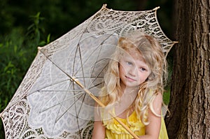 Little girl holding sunshade
