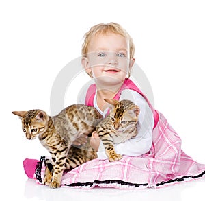 Little girl holding two cats. on white background