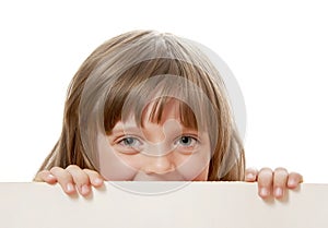 Little girl holding white board