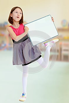 Little girl holding white poster.