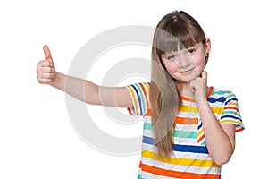 Little girl holds her thumb up