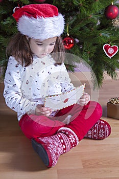 Little girl holds The Santa Letter Envelope
