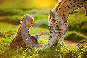 Little girl and horse