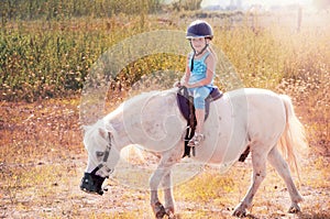 Little girl on the horse.