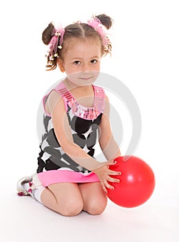 Little girl hugging the ball.