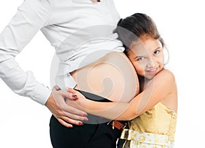 Little girl hugging belly