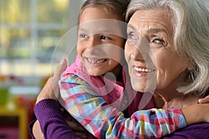 little girl hugging her grandmother