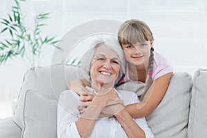 Little girl hugging her grandmother