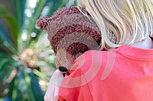 Little girl hugging her teddy