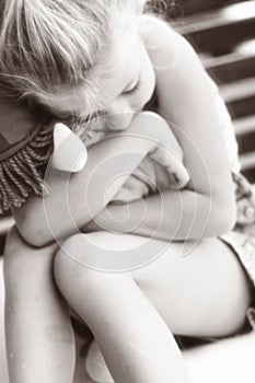 Little girl hugging toy soft focus