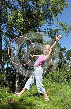 Little girl with hula hoop