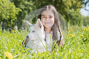 Little girl with husky puppy