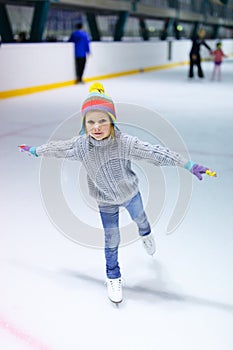 Little girl ice skating photo