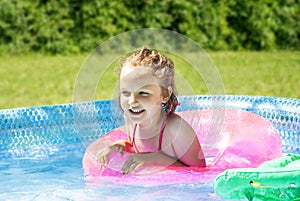 Little Girl in Inflatable Poll