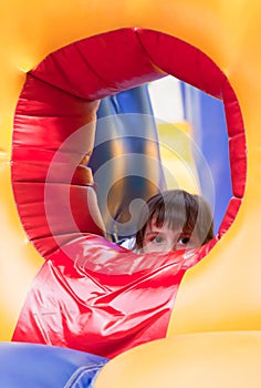 Little girl on inflatable slide