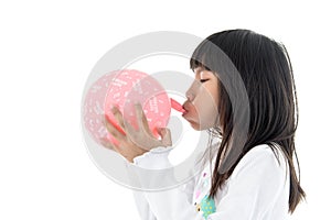 Little Girl inflate a Pink Balloon with Happy birthday message o