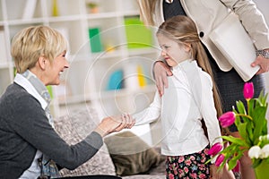 Little girl introduction her new babysitter photo