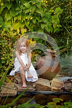 Little girl with a jug