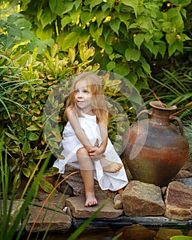 Little girl with a jug