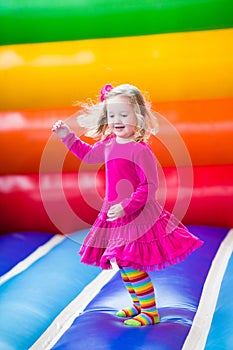 Little girl jumping and bouncing