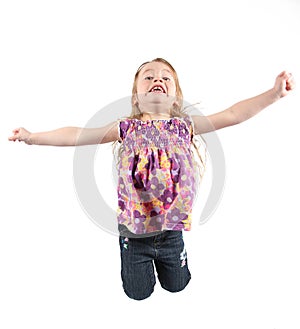 Little girl jumping for joy