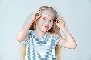 Little girl keeps safety goggles.