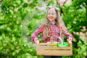 Little girl kid in forest. little girl with gardening tools. earth day. spring village country. ecology environment