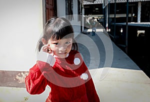 Little Girl kid wearing Santa Claus uniform, Kid having fun on Christmas holiday time