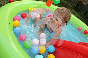 Little girl in kids pool