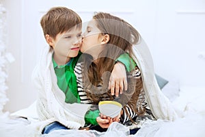 The little girl kisses and hugs boy. The concept of love and Val