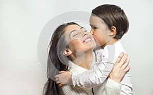 Little girl kissing her cousin