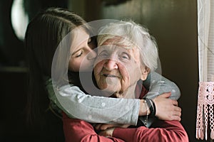 Little girl kissing her grandmother. Love.