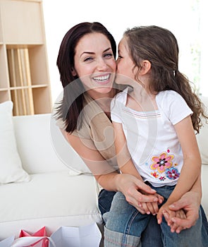 Little girl kissing her mother