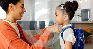 Little girl kissing her mother. Young mother hugging her daughter. Loving mother hugging daughter before school outside