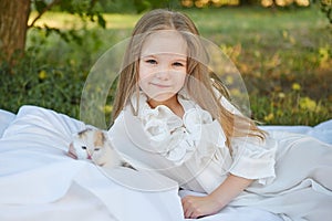 Little girl with kitten