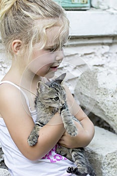 Little girl and kitten