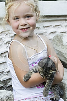 Little girl and kitten