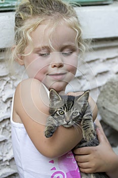 Little girl and kitten