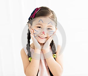 little girl with kitty painted face