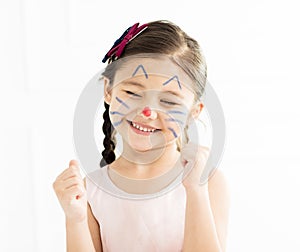 Little girl with kitty painted face