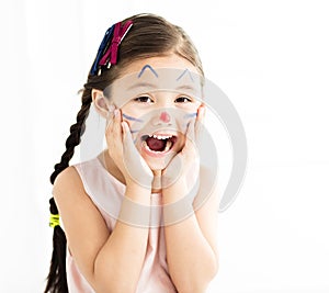 little girl with kitty painted face
