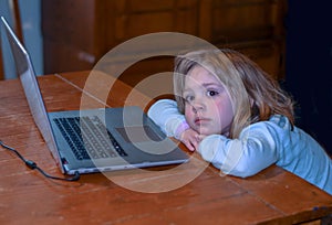 Little girl and a lap top computer