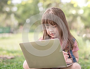 Little girl with laptop.