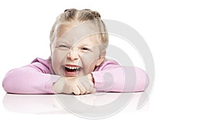 The little girl  laughs contagiously. Isolated over white background