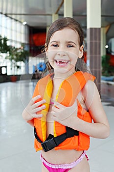 Little girl laughs after swimming