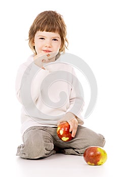 The little girl leads a healthy way of life, and eat apples