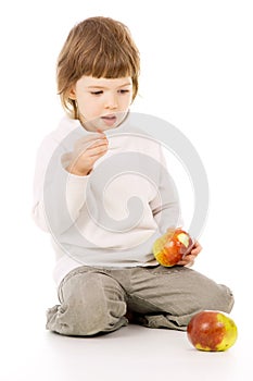The little girl leads a healthy way of life, and eat apples